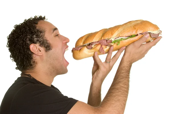 Hombre comiendo sándwich — Foto de Stock