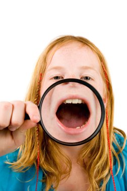 Little girl is showing her mouth clipart
