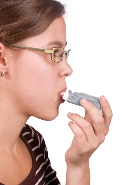 Stock image The woman uses a medicine for an asthma