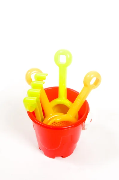 Red bucket and toys — Stock Photo, Image