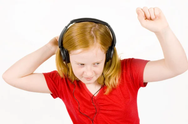 stock image Girl listening to music and dancing