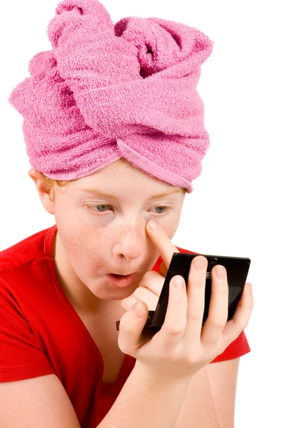 stock image Young beautiful girl looking in mirror