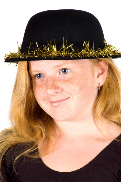 Girl is wearing a black hat with golden streamer — Stock Photo, Image