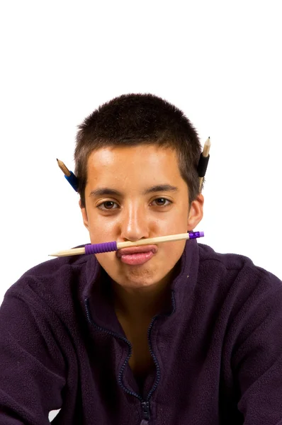 Pakistani schoolboy is playing funny with pencil — Stock Photo, Image