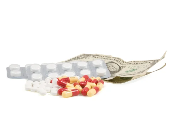 Pills with american dollar Royalty Free Stock Images