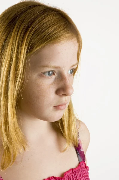 Sad looking redhead girl — Stock Photo, Image