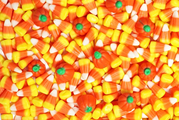 Candy corn and pumpkins — Stock Photo, Image