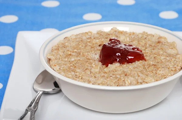 Closeup oatmeal with strawberry jam — Stock Photo, Image