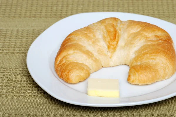 Crescent with butter — Stock Photo, Image