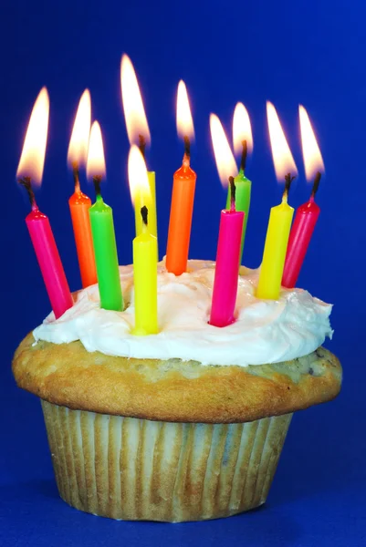 Cupcake with lots of candles — Stock Photo, Image