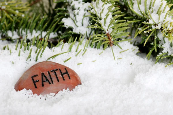 Faith stone in snow — Stock Photo, Image