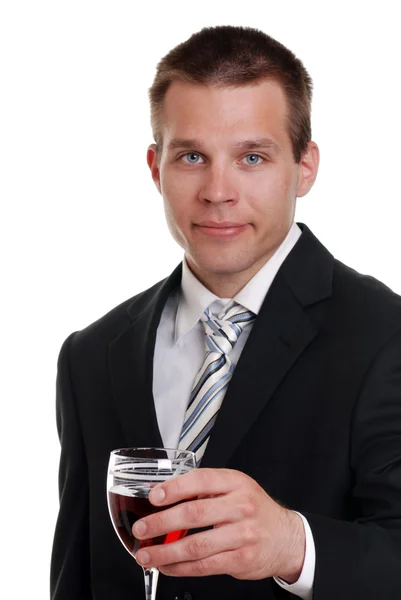 Mladý muž držící sklenici červeného vína — Stock fotografie
