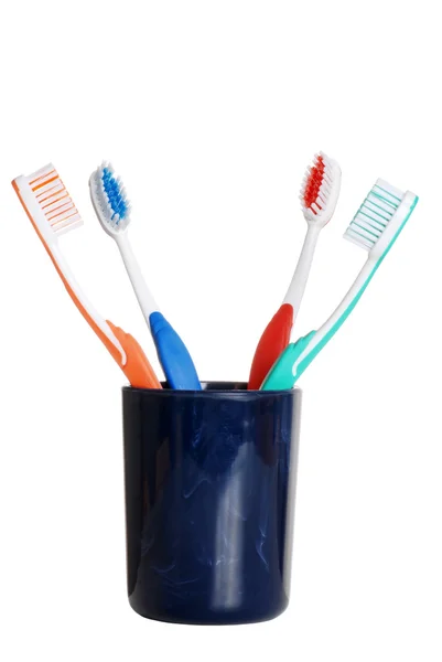 Цветные зубные щетки в держателе — стоковое фото