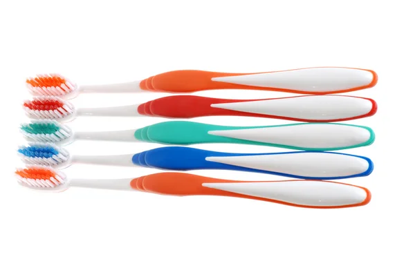 Fila isolada de escovas de dentes — Fotografia de Stock