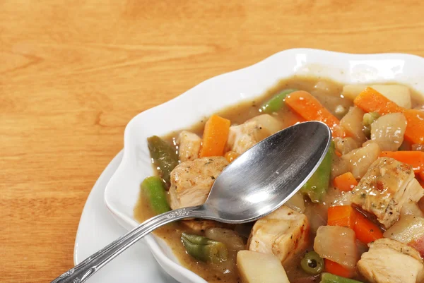 Closeup chicken stew with a spoon — Stock Photo, Image