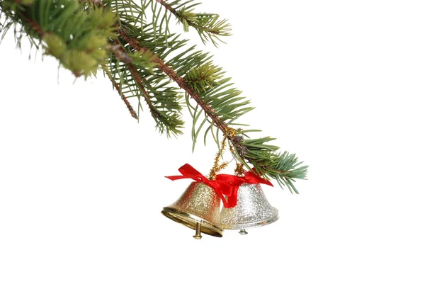 Gold and silver bell on a spruce tree branch — Stock Photo, Image