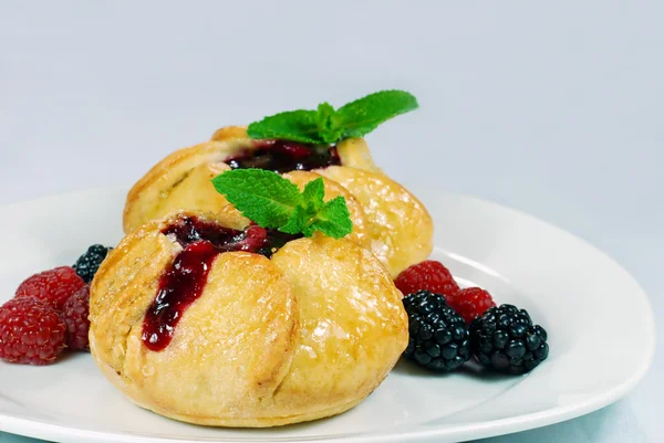 Fruit filled pastry with mint leaf — Stock Photo, Image
