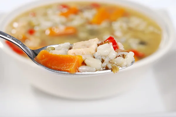 Macro spoonful chicken and wild rice soup — Stock Photo, Image
