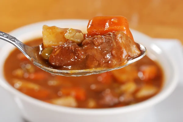 Macro spoonful of beef stew — Stock Photo, Image