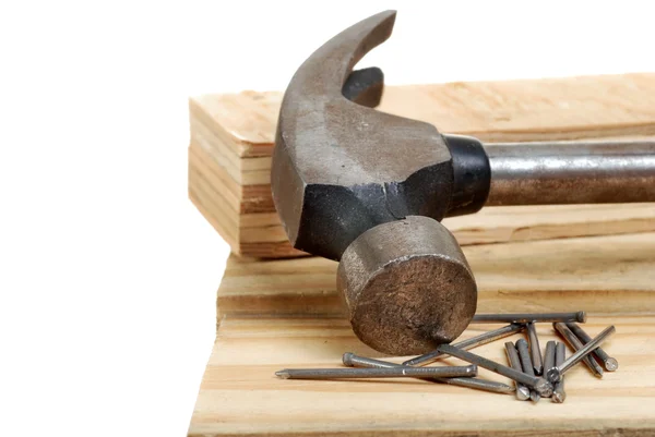 Hammer with lumber and nails — Stock Photo, Image