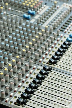 Sound board mixer with shallow depth of field clipart