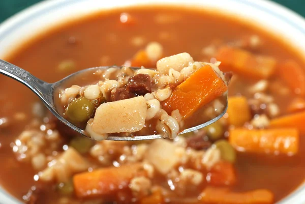 Spoonful of beef barley soup — Stock Photo, Image