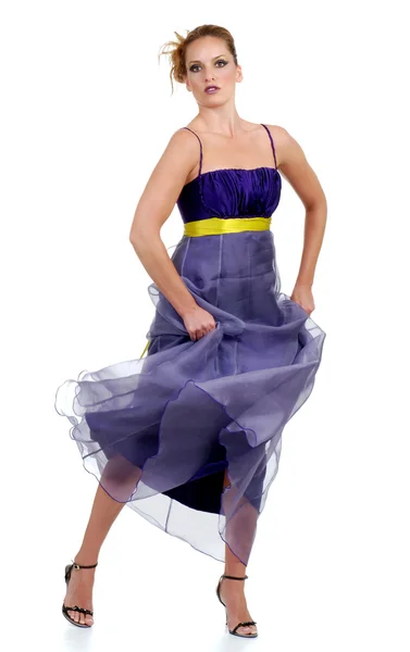 Woman dancing in a purple lace dress — Stock Photo, Image