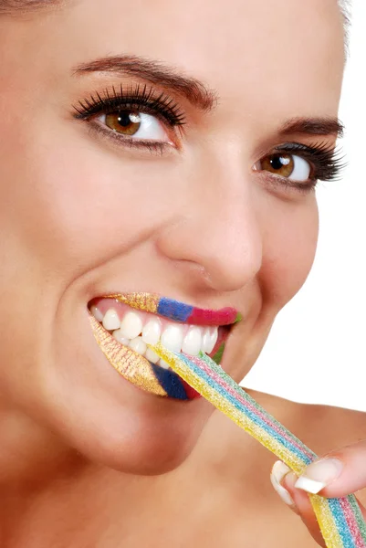 Vrouw met kleurrijke lint snoep — Stockfoto