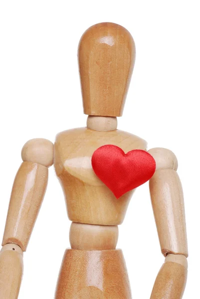 Figura de madeira com coração vermelho — Fotografia de Stock