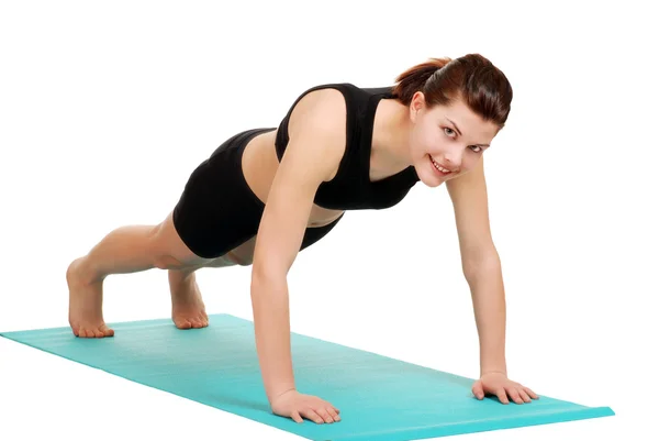 Young brunette woman doing push ups — Stock Photo, Image