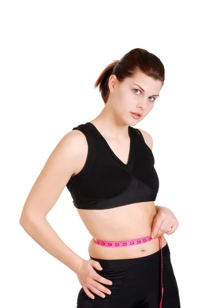 Mujer joven con cinta métrica alrededor de la cintura — Foto de Stock