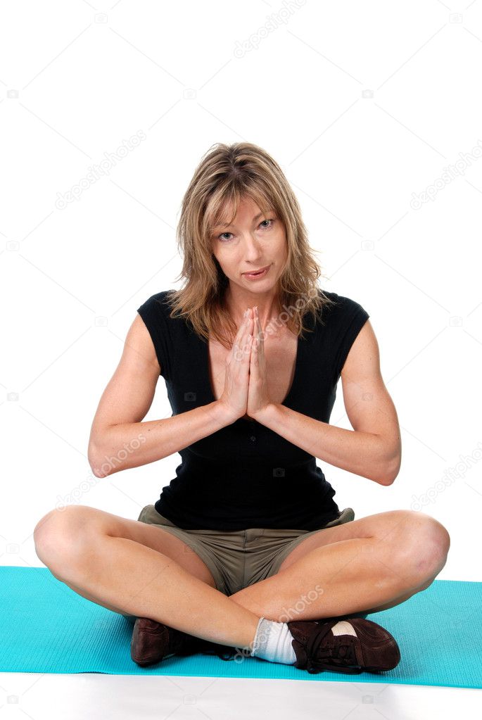 Women doing yoga on a mat