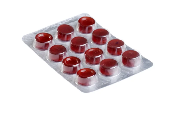 Pílulas vermelhas no pacote — Fotografia de Stock