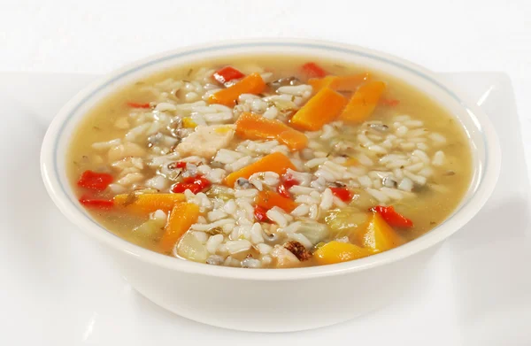 Bowl of chicken and wild rice soup with vegetables — Stock Photo, Image