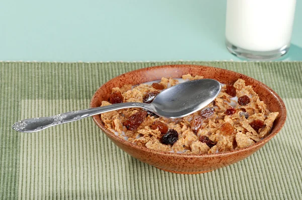 Bran and raisin cereal with spoon — Stock Photo, Image