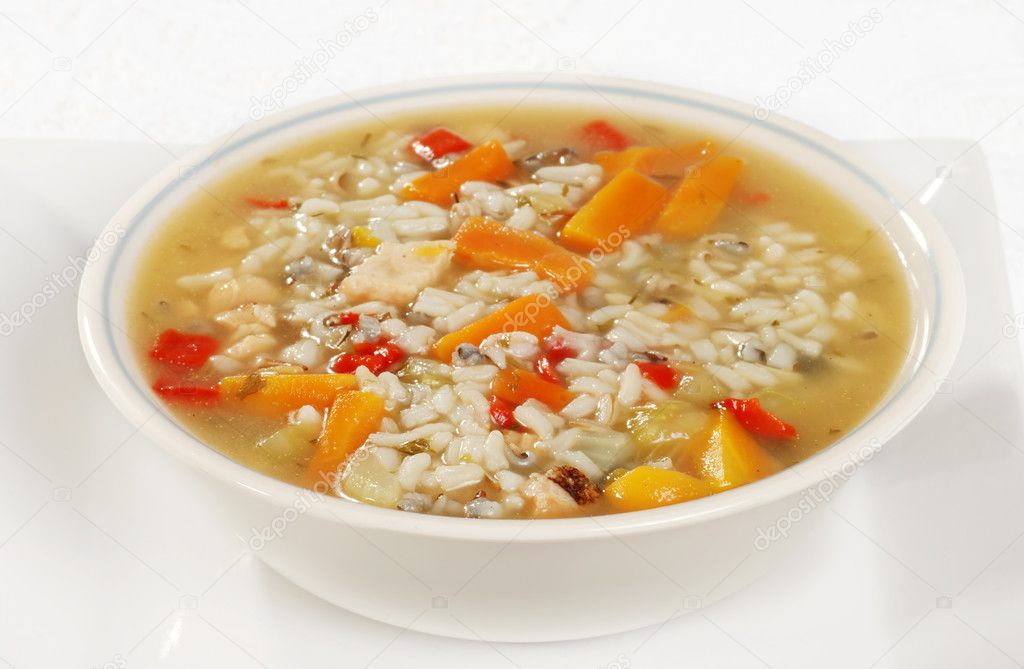 Bowl of chicken and wild rice soup with vegetables