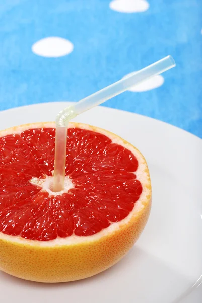 Grapefruit juice focus on fruit — Stock Photo, Image