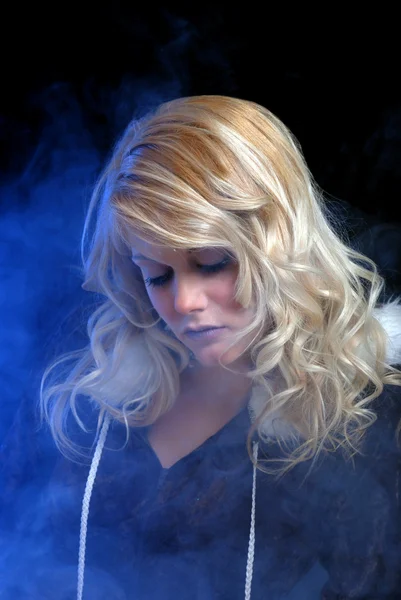 Ice woman dreaming with blue smoke — Stock Photo, Image