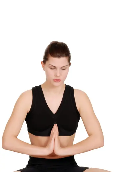 Kobieta robi joga z zamkniętymi oczami — Zdjęcie stockowe
