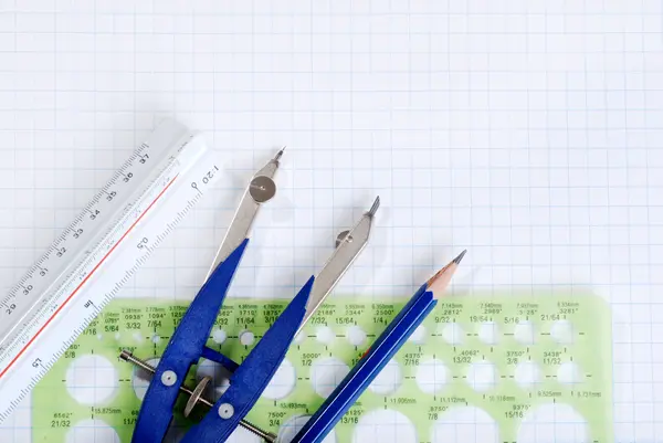 stock image Drafting tools on graph paper