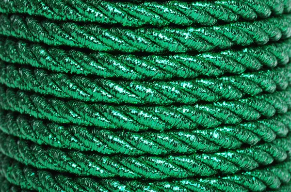 Green foil cord making a background — Stock Photo, Image