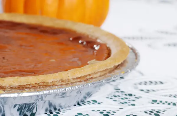 Pumpkin pie focus on crust — Stock Photo, Image