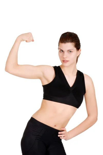 Mujer joven mostrando los músculos — Foto de Stock
