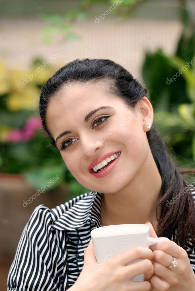 Happy spanish woman drinking coffee — Stock Photo © mcgphoto 3807063
