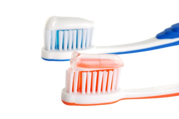Duas escovas de dentes com pasta — Fotografia de Stock