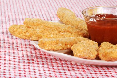 Chicken fingers focus on bowl clipart