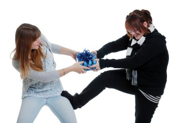 Sisters fighting over a present clipart