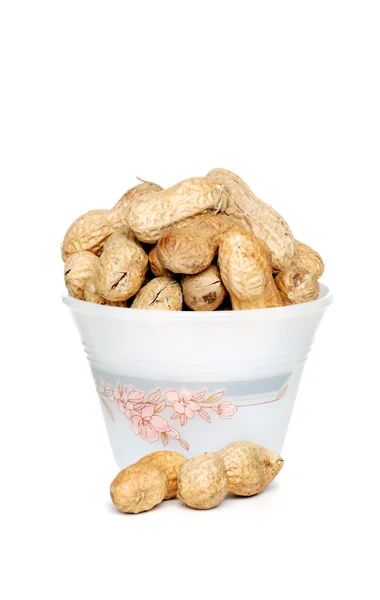 Amendoim com conchas em uma tigela — Fotografia de Stock