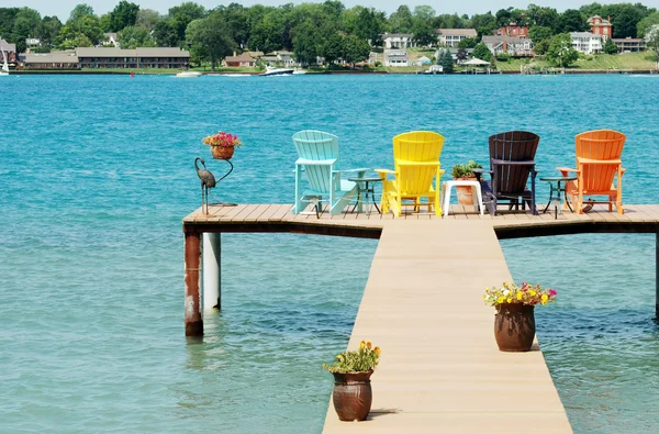 stock image Quite dock with colorful chairs and decorations