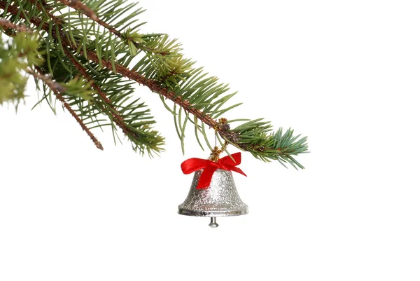 Silver bell on a spruce tree branch — Stock Photo, Image
